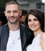  ??  ?? Local support: Hollywood star Tom and wife Charlotte Riley