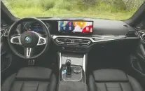  ?? ?? The BMW i4 M50 xdrive is started with a blue push-button.