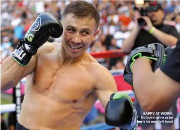  ??  ?? HAPPY AT WORK: Golovkin grins as he hurls his own left hand