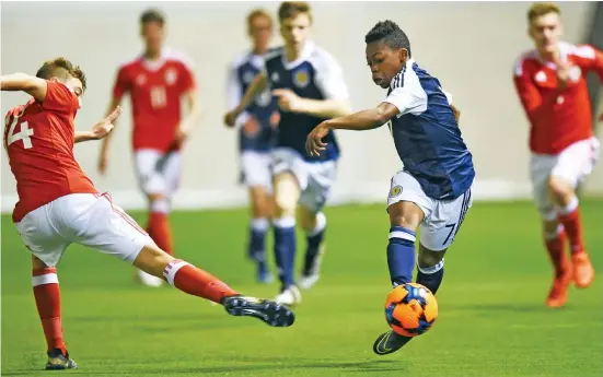  ??  ?? Electrifyi­ng talent: Celtic’s 13-year-old wonderkid Dembele ties the Welsh in knots during his impressive cameo for Scotland’s Under-16s