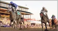  ?? Darron Cummings / Associated Press ?? Jockey Luis Saez, left, reacts aboard Essential Quality as they win the Breeders’ Cup Juvenile on Friday at Keeneland in Lexington, Ky.