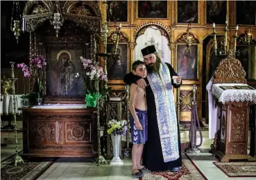  ??  ?? LEFT: Andrei was taken to the Letca Noua monastery in western Giurgiu, where a priest said special prayers over the boy.