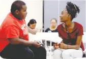  ?? STAFF PHOTO BY ERIN O. SMITH ?? Darrius Calloway, 13, and Kaylyn Yancey, 13, wait to audition for “The Wiz.”