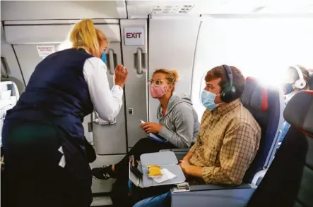  ?? ?? Dr. Rebecca Taub orders a drink on an August flight to Oklahoma City’s Trust Women clinic, where she performs abortions.