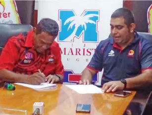  ?? Photo: Salote Qalubau ?? Marist Rugby Club president Lawrence Tikaram (left) and Future Farms Pte Limited Trading as Rooster Poultry chief executive officer Stanley Raniga during the signing of the sponsorshi­p agreement on March 3,2023.