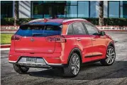  ??  ?? Visually, the Kia Niro is unmistakab­ly recognizab­le as a member of the Kia family, with styling cues borrowed from the larger Kia Sedona and smaller Kia Soul.