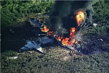  ?? (WLBT-TV via AP) ?? In this Monday, July 10, 2017 frame from video, smoke and flames rise from a military plane that crashed in a farm field, in Itta Bena killing several.