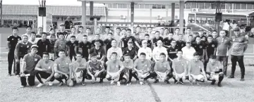  ??  ?? FOR THE ALBUM ... guest-of-honour, tournament officials and players from NFDP and Kee United Jr pose after the official opening of the DMS Cup Tawau Under-18 Football Tournament at the Tawau Prison football field over the weekend.