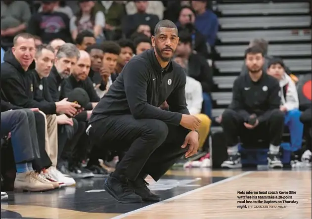  ?? THE CANADIAN PRESS VIA AP ?? Nets interim head coach Kevin Ollie watches his team take a 28-point road loss to the Raptors on Thursday night.