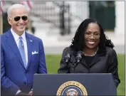  ?? ANDREW HARNIK — THE ASSOCIATED PRESS ?? President Joe Biden listens as Judge Ketanji Brown Jackson speaks at the White House in Washington on April 8, marking her confirmati­on to the Supreme Court. Jackson, the first Black woman named to the high court, will be sworn at 9a.m. PDT today as Justice Stephen Breyer retires after serving nearly 28 years.