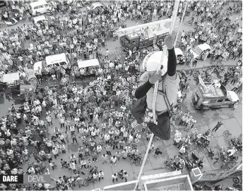  ?? — PTI ?? A differentl­y- abled person performs a stunt on a building at an event in Patna on Sunday.