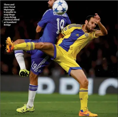  ?? PHOTO: GETTY IMAGES ?? Three and easy: Yuval Shpungin is unable to stop Diego Costa firing Chelsea’s third at Stamford Bridge