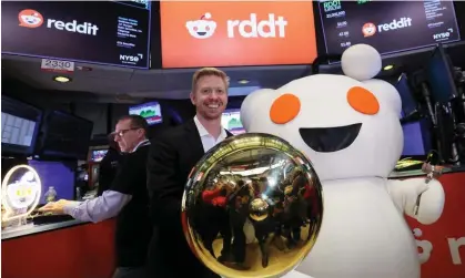  ?? ?? Steve Huffman, CEO of Reddit, stands next to Snoo, the mascot of Reddit, at the New York Stock Exchange. Photograph: Brendan McDermid/Reuters