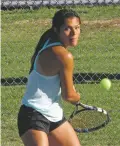  ?? WILL WEBBER THE NEW MEXICAN ?? Robertson sophomore Lauren Fulgenzi returns a backhand shot in Thursday’s Class 1A-4A state championsh­ip doubles match against Santa Fe Prep’s Grace Vigian and Isabel Voinescu. Fulgenzi and her playing partner, cousin Jenese Fulgenzi, won 6-7, 6-0, 6-1.