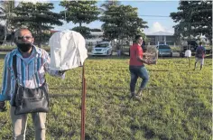  ??  ?? Songbird owners gather at a park in Paramaribo for a singing competitio­n.