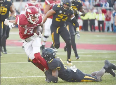  ?? Craven Whitlow/Special to the News-Times ?? Breaking free: Arkansas wide receiver Deon Stewart tries to break a tackle after catching a pass during the Razorbacks' SEC contest against Missouri last season. On Tuesday, Arkansas coach Chad Morris announced his coaching staff.