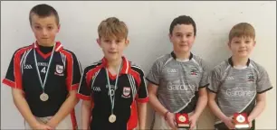  ??  ?? Kenny Murphy and Jack Young from Ferns (Under-13 boys’ doubles runners-up) with winners Eoin Kinsella and Ryan Murphy (Coolgreany).