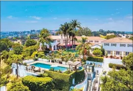  ?? ?? THE BEVERLY HILLS Post Office hacienda that belonged to the late Paul Allen has five structures that total more than 24,000 square feet. A glass-lined funicular travels from the pool to the tennis court. The property has sold for $45 million.