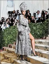  ?? HECTOR RETAMAL/GETTY-AFP ?? Rihanna sports a miter at Monday’s religion-themed Met Gala, a fashionabl­e fundraiser in New York.