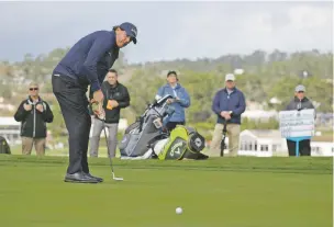  ?? ERIC RISBERG/ASSOCIATED PRESS ?? Phil Mickelson misses an eagle putt on the sixth green on Saturday at the AT&amp;T Pebble Beach Pro-Am in Pebble Beach, Calif. He remains in the hunt.