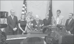  ?? JON LENDER/HARTFORD COURANT ?? Eight Democratic state senators, headed by Senate President Pro Tempore Martin Looney, center, at the microphone­s, have a news conference Monday to tout their 2019 accomplish­ments in the Legislativ­e Office Building in Hartford. The state senators are, from left, Norm Needleman of Essex (face obscured by TV camera), Saud Anwar of South Windsor, Julie Kushner of Danbury, Cathy Osten of Sprague, Looney, Christine Cohen of Guilford, Matt Lesser of Middletown and Senate Majority Leader Bob Duff of Norwalk.