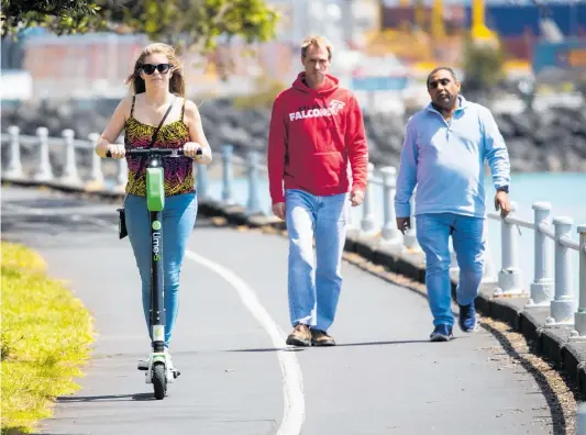  ??  ?? A Lime e-scooter being enjoyed on Auckland’s Tamaki Drive yesterday.