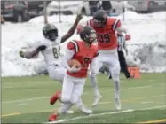  ?? BY JOE BOYLE JBOYLE@DIGITALFIR­STMEDIA.COM @BOYLERALER­TTROY ON TWITTER ?? Anthony Gallo lays a huge block on Husson’s Quintarion Brown to give Conor Davies space to make a move on Saturday, November 17, at the East Campus Stadium at RPI.