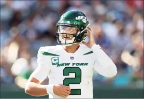  ?? Elsa / Getty Images ?? Jets quarterbac­k Zach Wilson looks on during the fourth quarter against the Patriots at MetLife Stadium on Unday in East Rutherford, N.J.