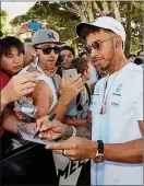  ??  ?? Sign here: Hamilton greets fans today