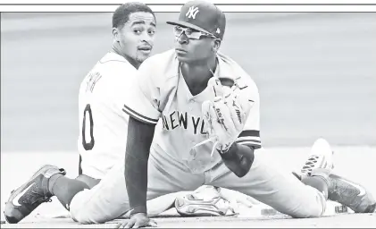  ?? AP ?? MAY THE FORCE BE WITH YOU: Mallex Smith (left) reacts after being forced out at second base by Didi Gregorius during the seventh inning of the Yankees’ 3-2 victory over the Rays at Citi Field on Wednesday.