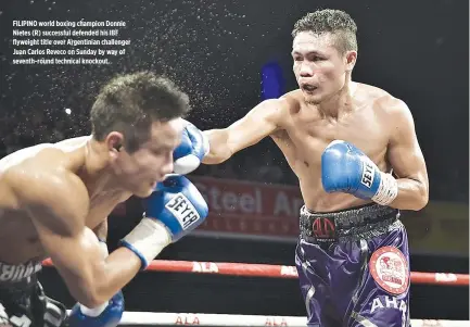  ??  ?? FILIPINO world boxing champion Donnie Nietes (R) successful defended his IBF flyweight title over Argentinia­n challenger Juan Carlos Reveco on Sunday by way of seventh-round technical knockout.