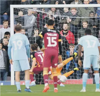  ??  ?? Jon McLaughlin saves Bradford’s penalty on Saturday.