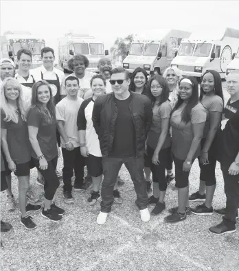  ??  ?? Host Tyler Florence (center) and the teams of “The Great Food Truck Race: Family Face-Off.”