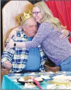  ?? (NWA Democrat-Gazette/Randy Moll) ?? David McNair receives a hug from Vanessa Mc- Nair, his daughter-in-law, after he unwittingl­y picked her coconut cream pie as the best pie at the reception held in his honor.