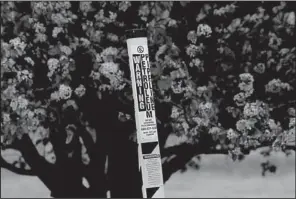  ?? Arkansas Democrat-Gazette/STEPHEN B. THORNTON ?? A warning sign marks the buried Pegasus pipeline in Mayflower about two blocks from where the pipeline rupture occurred. More photos from the Mayflower spill are at arkansason­line.com/galleries.