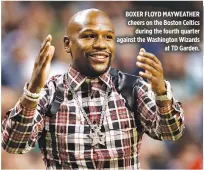  ??  ?? BOXER FLOYD MAYWEATHER cheers on the Boston Celtics during the fourth quarter against the Washington Wizards at TD Garden.