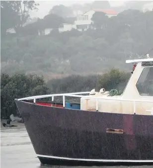  ??  ?? Emergency services rushed to the scene yesterday after the Francie charter boat is believed to have capsized near the treacherou­s Kaipara Harbour bar crossing.