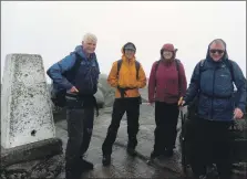  ?? 01_B21mountai­n05 ?? Nothing to see here. Participan­ts on the Goatfell Murder walk at the top of Goatfell.