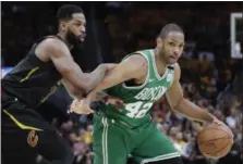  ?? TONY DEJAK — THE ASSOCIATED PRESS ?? The Celtics’ Al Horford drives on Tristan Thompson on May 21 at Quicken Loans Arena.