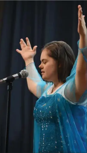  ?? ERIC BONZAR — THE MORNING JOURNAL ?? Alana Smale, 20, performs the song, “Let it Go,” from the Disney animated feature film ‘Frozen’ during Murray Ridge School’s fifth annual talent show March 29.