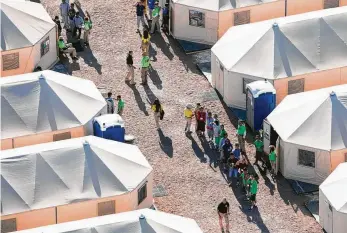  ?? Ivan Pierre Aguirre / Contributo­r ?? The tent city shelter near El Paso opened in June and has grown approximat­ely 10 times in size.