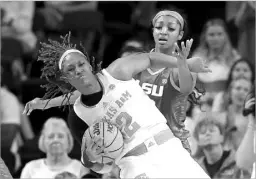  ?? Michael Wyke/the Associated Press ?? Texas A&M forward Janiah Barker gets tangled up with LSU forward Angel Reese on a rebound. LSU prevailed, 72-66.
