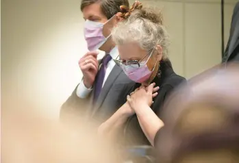  ?? J. PAT CARTER/GETTY ?? Crista Patrick, a member of the Tulsa City Council, listens to officials during a news conference Thursday at Saint Francis Hospital in Oklahoma. A gunman killed two doctors, a receptioni­st and a patient Wednesday, police said.