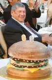  ?? AP-Yonhap ?? Big Mac creator Michael “Jim” Delligatti sits behind a Big Mac birthday cake at his 90th birthday party in Canonsburg, Pa. in this Aug. 21, 2008, file photo.