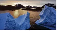  ?? AP ?? Icebergs float as the sun rises in Greenland, which has seen two of the biggest melts on record since 2012.