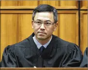  ?? GEORGE LEE / HONOLULU STAR-ADVERTISER 2015 ?? An order Friday by U.S. District Judge Derrick Watson expanded the list of family relationsh­ips by which people from six mostly Muslim countries can avoid the U.S. travel ban.