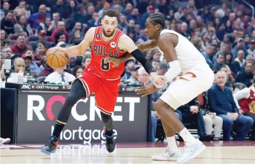  ?? RON SCHWANE/AP ?? Zach LaVine scored 23 points but took just three shots in the fourth quarter as the Bulls let a lead slip away Saturday against the Cavaliers.