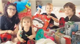  ?? FAMILY PHOTO ?? From left: Lillia Pluth, Dove Lindsey, Aidan Lindsey and Irayan Pluth celebrate Christmas.