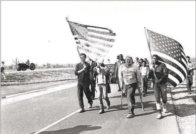  ?? Associated Press ?? CIVIL RIGHTS marchers head to Montgomery, Ala., in 1965. A recent attack on a Black man there was caught on video.