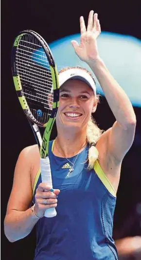  ?? EPA PIC ?? Caroline Wozniacki acknowledg­es the crowd after her 6-3, 6-0 win over Magdalena Rybarikova on Rod Laver Arena yesterday.